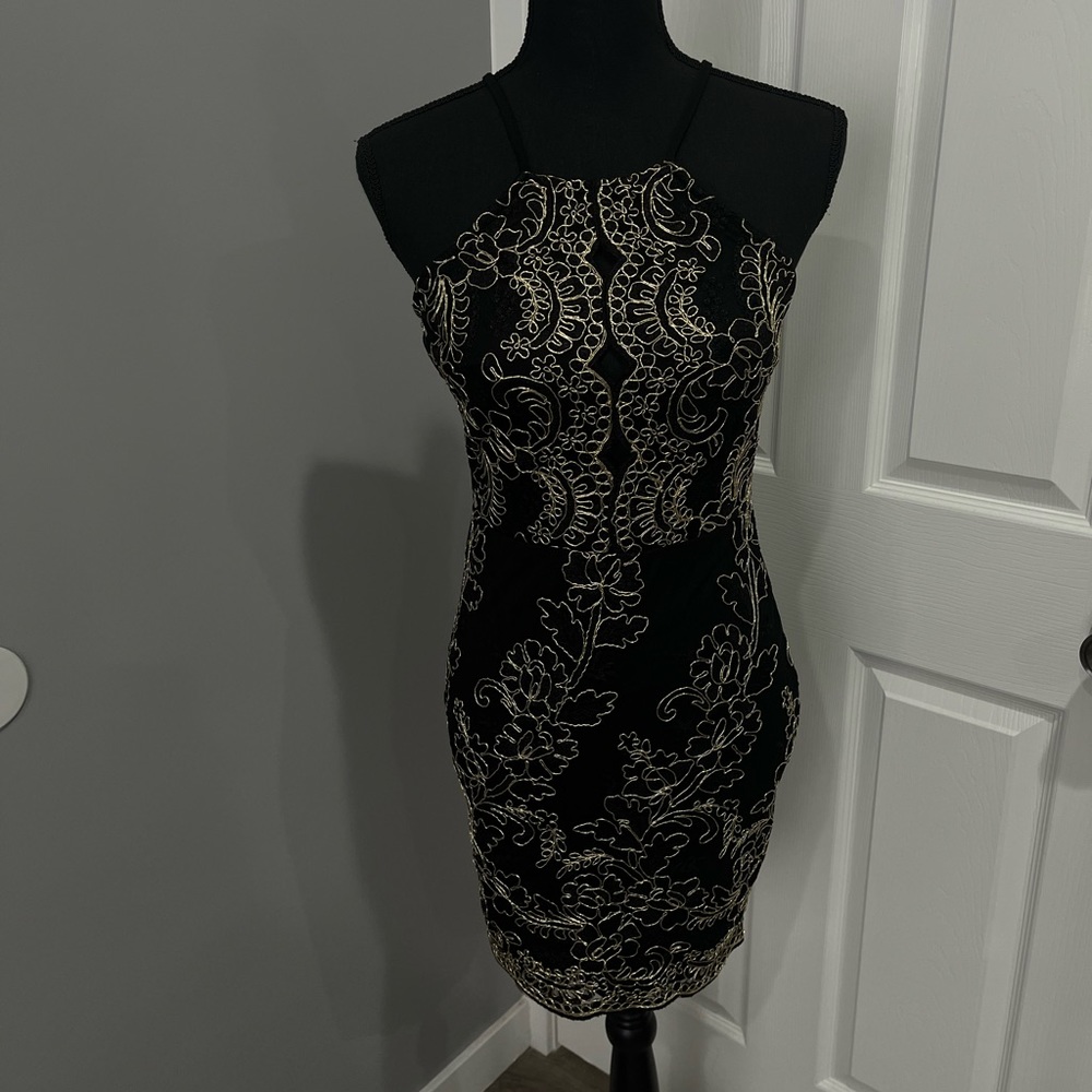 Black semi-formal dress with front cut out and gold piping
